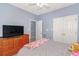 Comfortable bedroom with light blue walls and carpet flooring, complemented by a large double door closet at 2060 Cross Gate Blvd. # 102, Surfside Beach, SC 29575