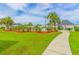 Beautifully landscaped community area featuring green grass, trees and a covered picnic pavilion at 2060 Cross Gate Blvd. # 102, Surfside Beach, SC 29575