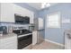 Bright kitchen with stainless steel appliances and white cabinetry at 2060 Cross Gate Blvd. # 102, Surfside Beach, SC 29575