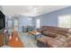Open-concept living and dining area with hardwood floors and stylish furnishings at 2060 Cross Gate Blvd. # 102, Surfside Beach, SC 29575