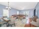 Bright living area with a dining table, plush sofa, and plenty of natural light at 2060 Cross Gate Blvd. # 102, Surfside Beach, SC 29575