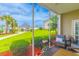 Cozy screened-in patio with comfortable seating and a view of the community pool at 2060 Cross Gate Blvd. # 102, Surfside Beach, SC 29575