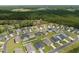 An aerial view of the Sugarloaf community showcasing neat rows of homes and lush surroundings at 228 Averyville Dr., Conway, SC 29526