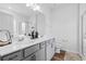 Bathroom with double sink vanity, framed mirror, and modern fixtures at 228 Averyville Dr., Conway, SC 29526