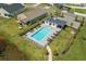 Aerial view of a pristine community pool with lounge chairs and well-maintained landscaping at 228 Averyville Dr., Conway, SC 29526