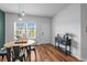A dining area features a round table, stylish chairs, and a window with neighborhood views at 228 Averyville Dr., Conway, SC 29526