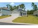 Charming one-story home with attached garage, well-manicured lawn, and lovely landscaping at 228 Averyville Dr., Conway, SC 29526