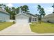 Charming one-story home with attached garage, well-manicured lawn, and lovely landscaping at 228 Averyville Dr., Conway, SC 29526