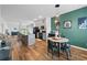A modern kitchen and dining area features stainless steel appliances and bar stool seating at 228 Averyville Dr., Conway, SC 29526