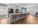 Modern kitchen featuring a kitchen island, granite countertops, stainless steel appliances, and stylish barstools at 228 Averyville Dr., Conway, SC 29526