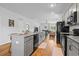Spacious kitchen featuring granite countertops, stainless steel appliances, pantry and an open layout to the living area at 228 Averyville Dr., Conway, SC 29526
