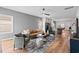 Bright living room featuring modern decor, hardwood floors, and a ceiling fan at 228 Averyville Dr., Conway, SC 29526