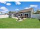 Inviting backyard featuring a well-maintained lawn, patio and a garden area with colorful flowers at 232 Angel Wing Dr., Myrtle Beach, SC 29588