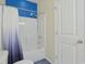Bright bathroom featuring a shower-tub combination with a stylish shower curtain and safety bar at 232 Angel Wing Dr., Myrtle Beach, SC 29588