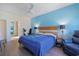 Spacious bedroom with a king-sized bed, ceiling fan, and ensuite bathroom featuring modern fixtures and ample natural light at 232 Angel Wing Dr., Myrtle Beach, SC 29588