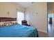 Comfortable bedroom with hardwood floors, a cozy bed, and a reading chair at 232 Angel Wing Dr., Myrtle Beach, SC 29588