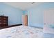 Bedroom with light blue walls and a bed with a white and blue decorative comforter at 232 Angel Wing Dr., Myrtle Beach, SC 29588