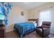 Bedroom with a cozy recliner chair, a bed with a blue comforter, and a flat screen TV at 232 Angel Wing Dr., Myrtle Beach, SC 29588