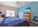 Comfortable bedroom with hardwood floors, a ceiling fan, and a flat screen TV at 232 Angel Wing Dr., Myrtle Beach, SC 29588