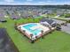 An aerial view of the community pool surrounded by lounge chairs and a well-kept lawn at 232 Angel Wing Dr., Myrtle Beach, SC 29588