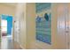 Hallway featuring a wall-mounted organizer, a door, and an entrance to the laundry room at 232 Angel Wing Dr., Myrtle Beach, SC 29588