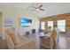 Bright living room featuring hardwood floors, vaulted ceilings, and a statement wood accent wall at 232 Angel Wing Dr., Myrtle Beach, SC 29588