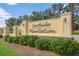 Entrance sign for Surfside Plantation with manicured landscaping and decorative lighting at 232 Angel Wing Dr., Myrtle Beach, SC 29588