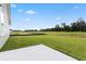 Freshly poured concrete patio in a spacious backyard with newly laid sod near a new home at 24 Cape Point Dr., Conway, SC 29527