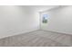 Light-filled bedroom with neutral walls, plush carpet, and a bright window offering natural light at 24 Cape Point Dr., Conway, SC 29527