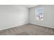 Bedroom with neutral carpet, white walls, and a window with a view of the outdoors at 24 Cape Point Dr., Conway, SC 29527