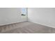 Bedroom featuring neutral carpet, a window with blinds, and a crisp, white paint scheme at 24 Cape Point Dr., Conway, SC 29527