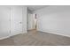 Bedroom with neutral carpet, fresh paint, and two doors, offering a serene retreat at 24 Cape Point Dr., Conway, SC 29527