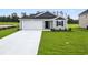 Charming single-story home with well-manicured lawn and attached one car garage at 24 Cape Point Dr., Conway, SC 29527