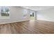 Bright living room featuring wood flooring, recessed lighting, and large windows at 24 Cape Point Dr., Conway, SC 29527
