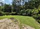 Backyard with a brick-lined fire pit, perfect for outdoor gatherings and relaxation at 244 Colby Ct., Myrtle Beach, SC 29588