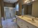 Bathroom with a double vanity, a shower with a glass door, a tub, and ample counter space at 244 Colby Ct., Myrtle Beach, SC 29588