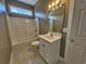 Small bathroom featuring a single vanity, a sink, and a tub-shower combo at 244 Colby Ct., Myrtle Beach, SC 29588