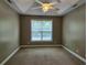 Neutrally decorated bedroom featuring a ceiling fan and a window that lets in natural light at 244 Colby Ct., Myrtle Beach, SC 29588