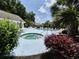 Community pool area with inviting jacuzzi, tables, lounge chairs and tropical landscaping at 244 Colby Ct., Myrtle Beach, SC 29588