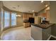 Kitchen with tile floor, breakfast nook with natural light, and breakfast bar at 244 Colby Ct., Myrtle Beach, SC 29588