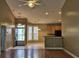 View from living room into breakfast nook with bay window, and kitchen with tile floors and tan cabinets at 244 Colby Ct., Myrtle Beach, SC 29588