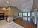 Spacious living room featuring laminate floors, high ceilings, plenty of natural light, and open floor plan at 244 Colby Ct., Myrtle Beach, SC 29588
