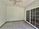 Enclosed patio with ceiling fan and sliding glass doors for seamless indoor/outdoor living at 244 Colby Ct., Myrtle Beach, SC 29588