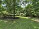Community picnic area with lush landscaping, trees and tables for Gathering gatherings and relaxation at 244 Colby Ct., Myrtle Beach, SC 29588