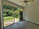 Screened porch offering views of the lush backyard at 244 Colby Ct., Myrtle Beach, SC 29588