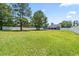 Expansive backyard features ample green space, trees, and a privacy fence at 250 Penn Circle, Galivants Ferry, SC 29544