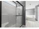 Modern bathroom features a glass-enclosed shower and a tiled bathtub at 250 Penn Circle, Galivants Ferry, SC 29544