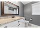 Bathroom boasts a granite countertop vanity and a framed mirror at 250 Penn Circle, Galivants Ferry, SC 29544