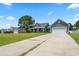 Lovely one-story home, showcasing a well-kept lawn, two-car garage, and inviting front porch at 250 Penn Circle, Galivants Ferry, SC 29544