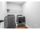 Laundry room featuring a washer, dryer and wire shelving at 250 Penn Circle, Galivants Ferry, SC 29544